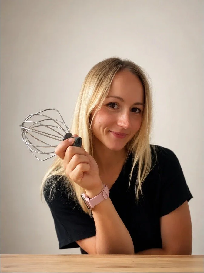 Martina holding a whisk in her Portsmouth studio
